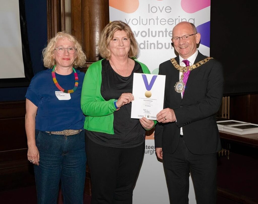 Robert Aldridge, The Rt. Hon. Lord Provost of the City of Edinburgh presenting one of the certificates to one of our volunteers accompanied by Ursula our Engagement Coordinator at the City Chambers in Edinburgh. 