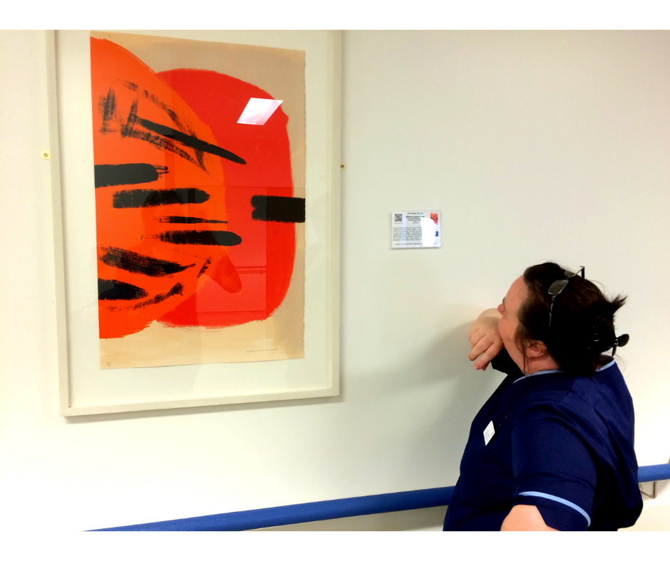 Hospital worker looking at one of our artworks at Balfour Hospital 